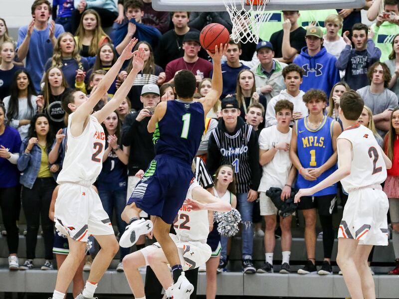 Timpanogos' Robert Christensen puts a layup in to give his team a 45-43 lead over Skyridge with one second left, clinching the game for Timpanogos, in a boys basketball game in Lehi on Tuesday, Feb. 12, 2019.