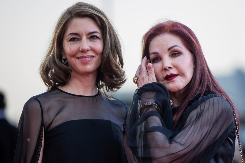 Director Sofia Coppola, left, and Priscilla Presley pose for photographers upon arrival for the premiere of the film “Priscilla” during the 80th edition of the Venice Film Festival in Venice, Italy.