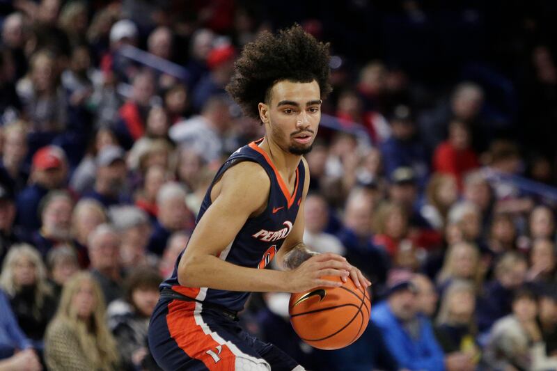 Pepperdine guard Houston Mallette controls the ball