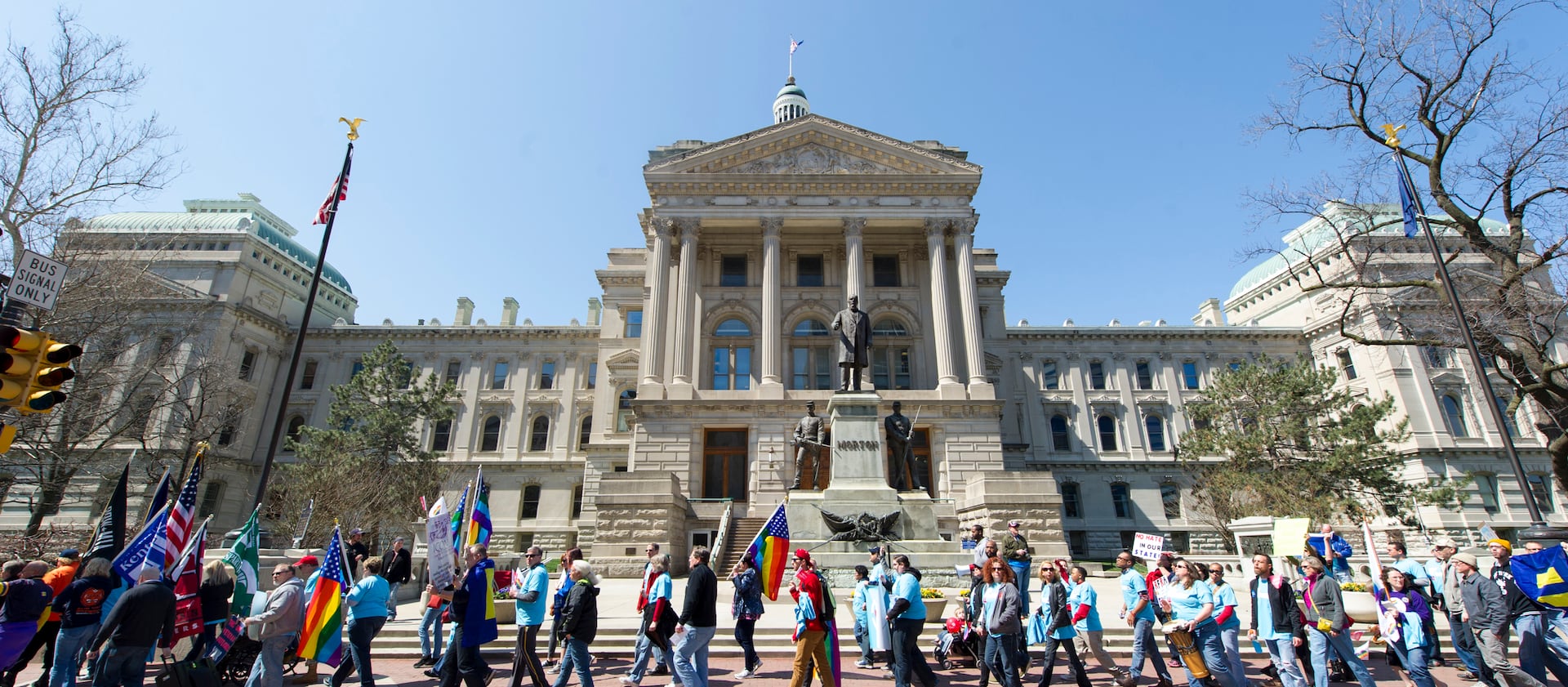 Opponents of Indiana Senate Bill 101, the Religious Freedom Restoration Act, march past the Indiana Statehouse en route to Lucas Oil Stadium in Indianapolis on Saturday, April 4, 2015 to push for a state law that specifically bars discrimination based on