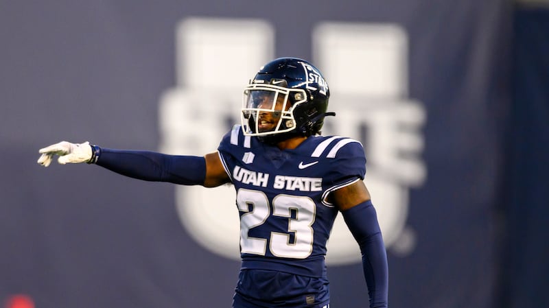 Utah State safety Devin Dye (23) motions to teammates on defense during a football game on Oct. 7, 2023, in Logan.