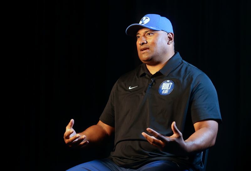 BYU head football coach Kalani Sitake answers interview questions during BYU Football Media Day.