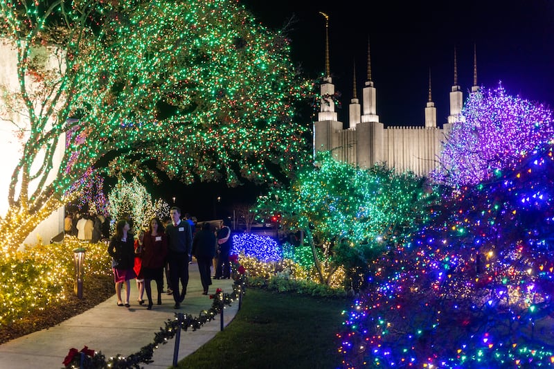 Guests walk among the Christmas lights display at the Washington D.C. Temple grounds in Kensington, Maryland, on Nov. 30, 2022.