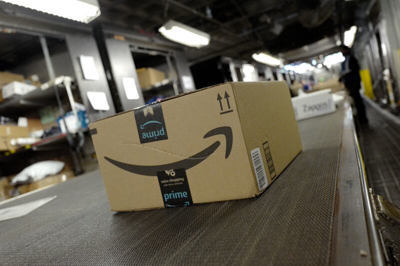 FILE - A package from Amazon Prime moves on a conveyor belt at a UPS facility, Tuesday, May 9, 2017 in New York.