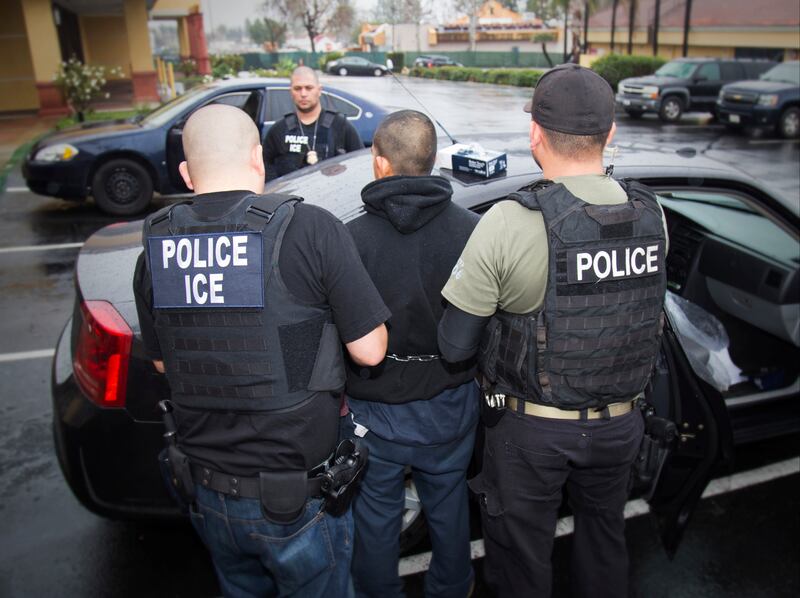 FILE - In this Feb. 7, 2017, file photo released by U.S. Immigration and Customs Enforcement, foreign nationals are arrested during a targeted enforcement operation conducted by U.S. Immigration and Customs Enforcement (ICE) aimed at immigration fugitives
