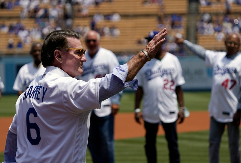 Former Los Angeles Dodgers first baseman Steve Garvey waves to fans prior to a baseball game.
