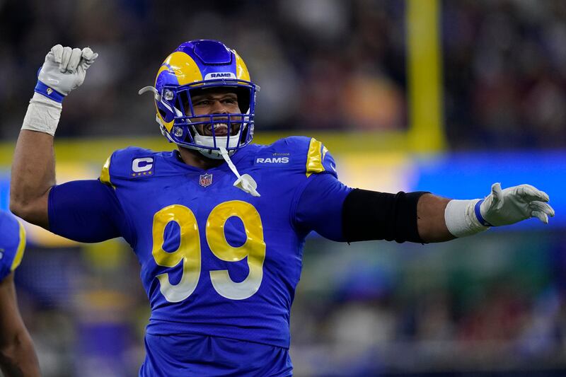 Los Angeles Rams defensive end Aaron Donald (99) celebrates during the first half of an NFL wild-card playoff football game against the Arizona Cardinals in Inglewood, Calif.