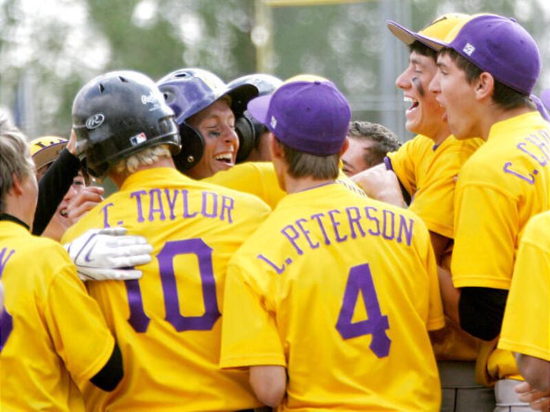 Wayne High School baseball players celebrate after a home run by Jordan Ellett during the Badgers' 17-4 win over Panguitch for the 1A state championship at Bruce Hurst Field in St. George Saturday. It was the Badgers' 51st consecutive win overall.