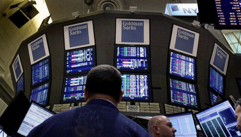 In this Thursday, March 15, 2012, file photo, traders work at the Goldman Sachs posts on the floor of the New York Stock Exchange. According to the McKinsey Global Institute, a research unit associated with the consulting firm McKinsey & Company, the Unit