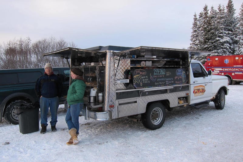 Jim Nardelli and Jessica Knox wait for customers in the Lookout Mountain ski area parking lot in Alaska on Dec. 4, 2010 in Homer, Alaska. They joined Mike Hiller, who has been in the food service industry for more than 25 years, in opening a taco truck.
