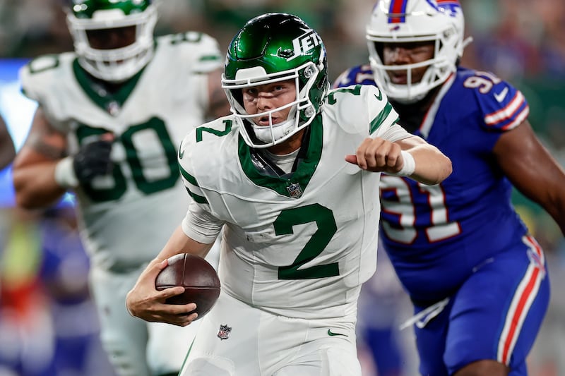New York Jets quarterback Zach Wilson (2) carries the ball against the Buffalo Bills on Sept. 11, 2023.
