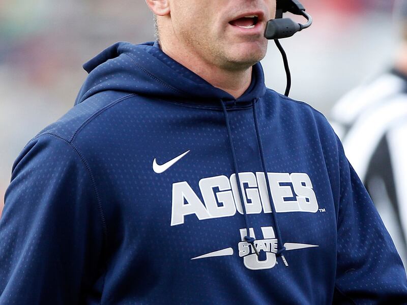 Utah State coach Matt Wells works the sidelines during the first half of an NCAA college football game against New Mexico in Albuquerque, N.M., Saturday, Nov. 4, 2017. (AP Photo/Andres Leighton)