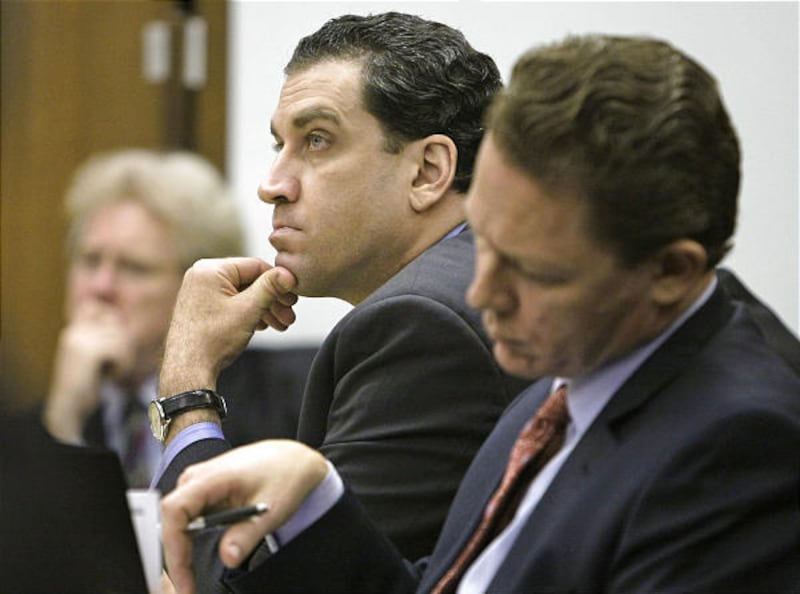 Yazeed Essa, center, is shown in court Monday during opening statements in the trial of the Ohio doctor charged in the 2005 cyanide death of his wife, a case delayed for years while authorities tried to extradite the fugitive defendant from Cyprus.