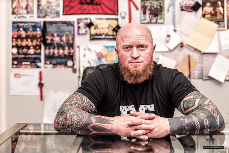 Rob Eastman poses for a picture at his fitness center in Centerville, Utah.