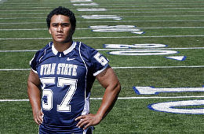 Utah State's Frank Maile has found juggling football and fatherhood a rewarding challenge. The Ags play Arkansas Saturday.