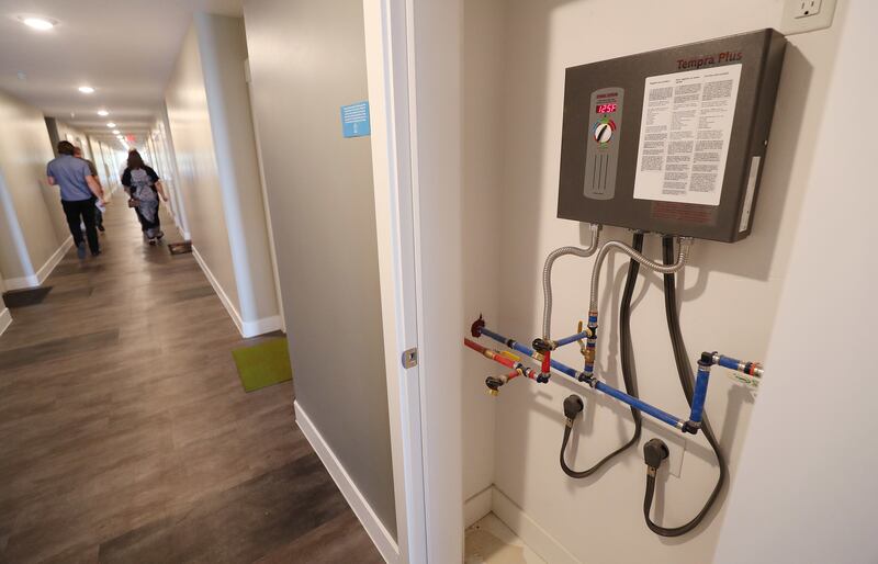 Tankless water heaters are used in net-zero emissions apartments called Project Open in Salt Lake City on Tuesday, June 12, 2018. Its developers say it's the tallest net-zero apartment building in Utah and the first to be built for the same cost as a conv