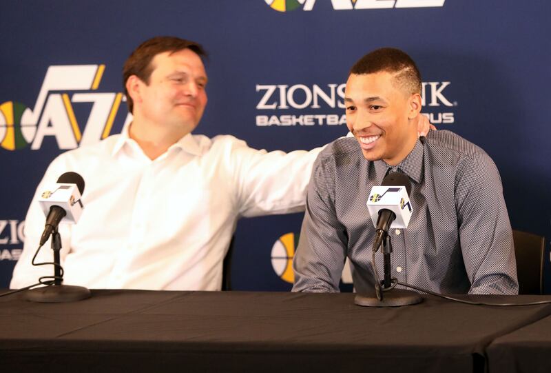 Utah Jazz general manager Dennis Lindsey squeezes Dante Exum.