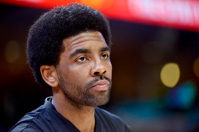 Brooklyn Nets guard Kyrie Irving warms up before an NBA basketball game.