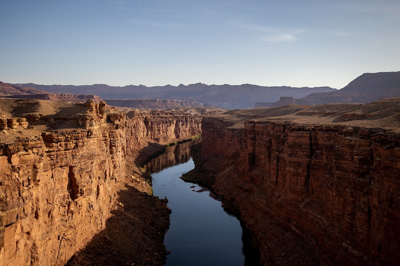 Colorado River flows through Marble Canyon as seen from the Historic Navajo Bridge in Coconino County, Arizona.