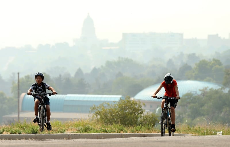 FILE - Bikers make their way to the shoreline trail in Salt Lake City on Thursday, August 23, 2018.