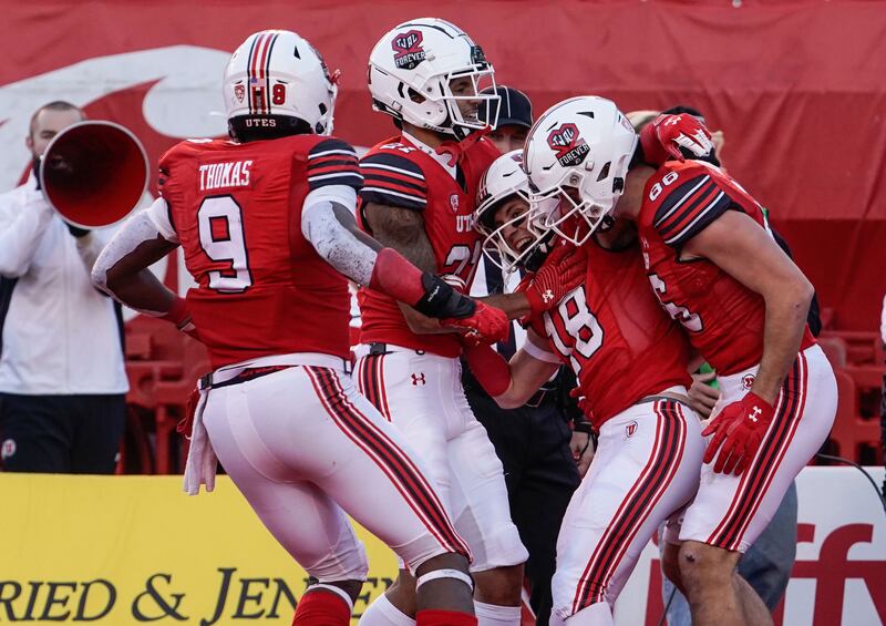 Utah wide receiver Britain Covey (18) celebrates a touchdown at Rice-Eccles Stadium in Salt Lake City on Nov. 26, 2021.