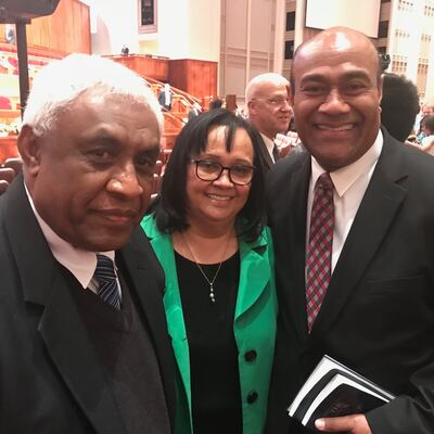 Nemani Delaibatiki, left, is pictured with Elder Taniela B. Wakolo and his wife. Delaibatiki met Elder Wakolo several years ago when he joined the church in Fiji.