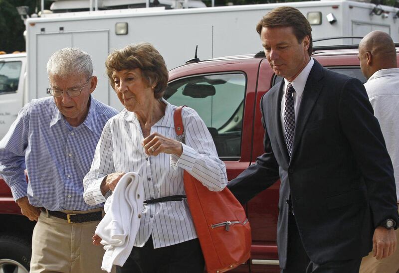 Former presidential candidate and Sen. John Edwards, right, arrives at a federal courthouse with his parents Wallace and Bobbie Edwards in Greensboro, N.C., Wednesday, May 16, 2012. Edwards has pleaded not guilty to six counts related to campaign finance