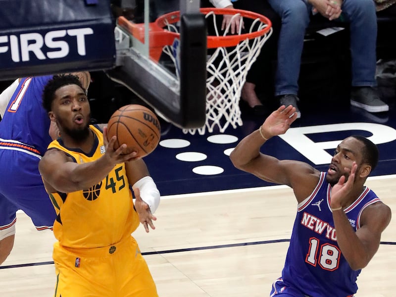 Utah Jazz guard Donovan Mitchell lays the ball up