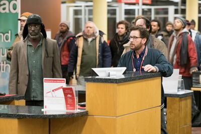 Michael Kenneth Williams as Jackson and Emilio Estevez as Stuart Goodson in "The Public."