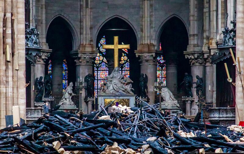 Debris are seen inside Notre Dame cathedral in Paris, Tuesday, April 16, 2019. Firefighters declared success Tuesday in a more than 12-hour battle to extinguish an inferno engulfing Paris' iconic Notre Dame Cathedral that claimed its spire and roof, but s