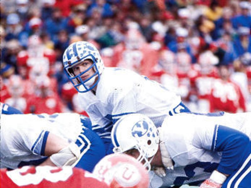 BYU quarterback Jim McMahon lines up under center during the Cougars’ 56-6 win over Utah in Salt Lake City on Nov. 22, 1980.