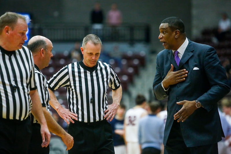 Layton Christian Academy Eagles boys basketball coach Bobby Porter talks with referees.