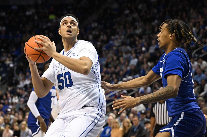 Brigham Young Cougars center Aly Khalifa (50) spins toward the basket with Georgia State Panthers guard Lucas Taylor (31) defending