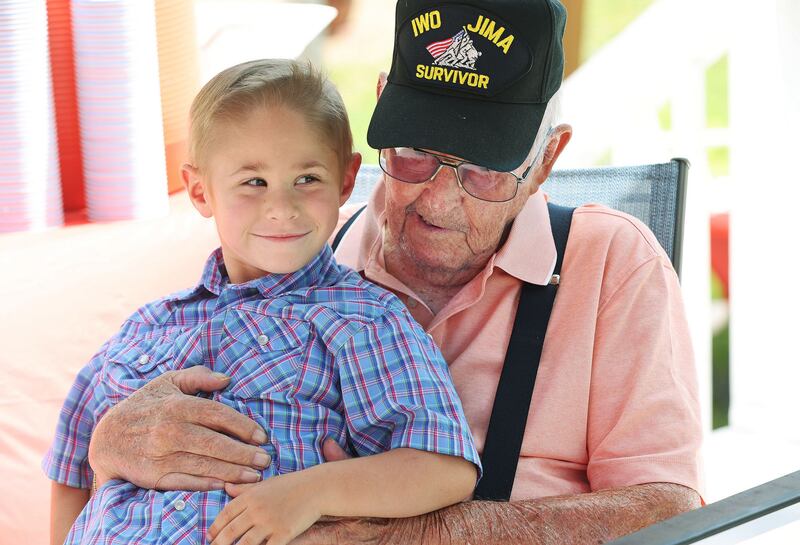 James Kimose, Farr West, talks with his great-great grandson Tad Fox, 5, as he celebrates his 101st birthday in Ogden on Sunday. Kimose is a WWII marine veteran and fought at Iwo Jima.