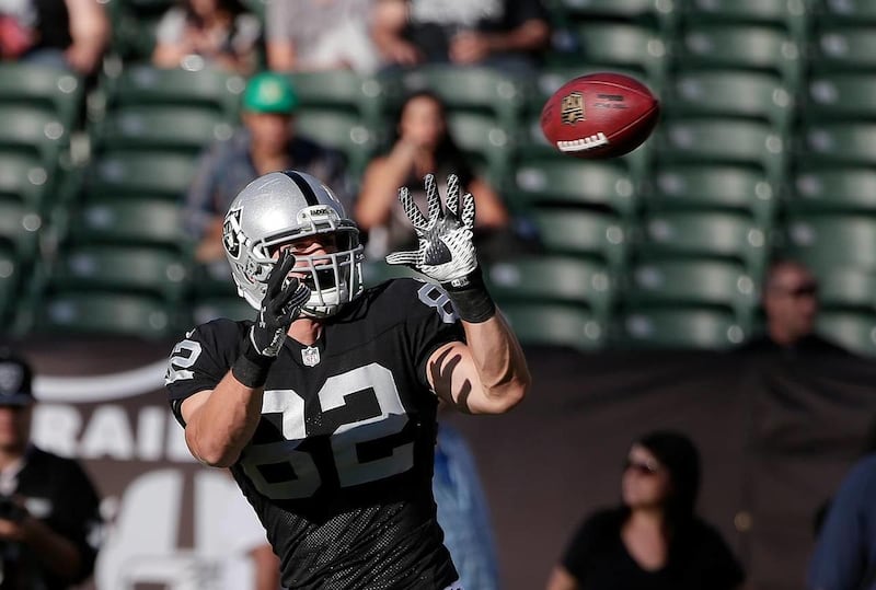 Oakland Raiders tight end Jake Murphy (82) before an NFL preseason football game against the Detroit Lions in Oakland, Calif., Friday, Aug. 15, 2014. The former Ute Murphy signed to the Dolphins' practice squad Tuesday.