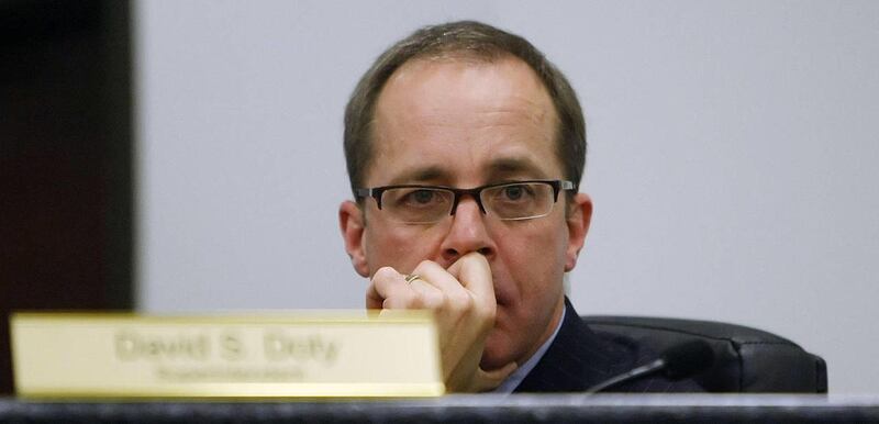Superintendent Dr. David S. Doty listens during the board meeting. Residents voice their opinions Tuesday, April 17, 2012, during a Canyons School Board meeting where some are requesting an investigation of Superintendent Dr. David S. Doty.