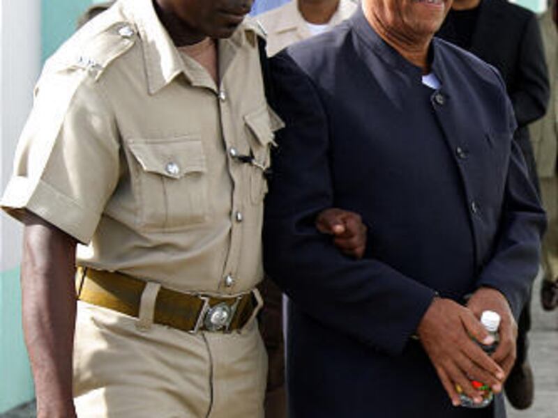 Prisoner Bernard Coard, right, is seen in 2007 in St. George's, Grenada.
