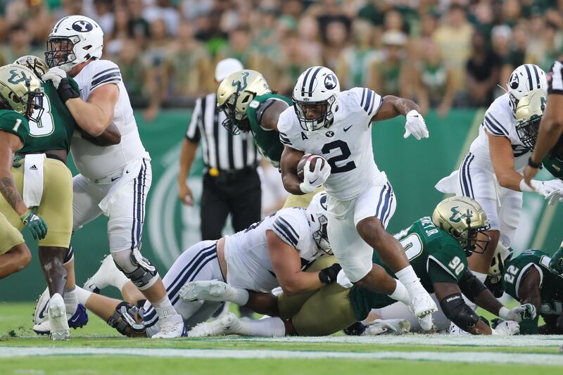 BYU running back Chris Brooks bursts through a hole en route to the end zone in season opener against USF Sept. 3, 2022.