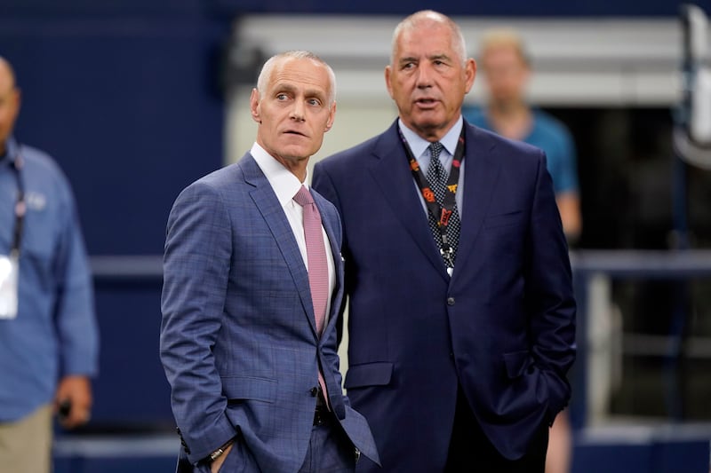 Incoming Big 12 commissioner Brett Yormark, left, stands with outgoing commissioner Bob Bowlsby at Big 12 media days.