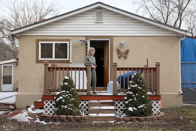 Cheryl Johnson in the backyard of her South Salt Lake home.