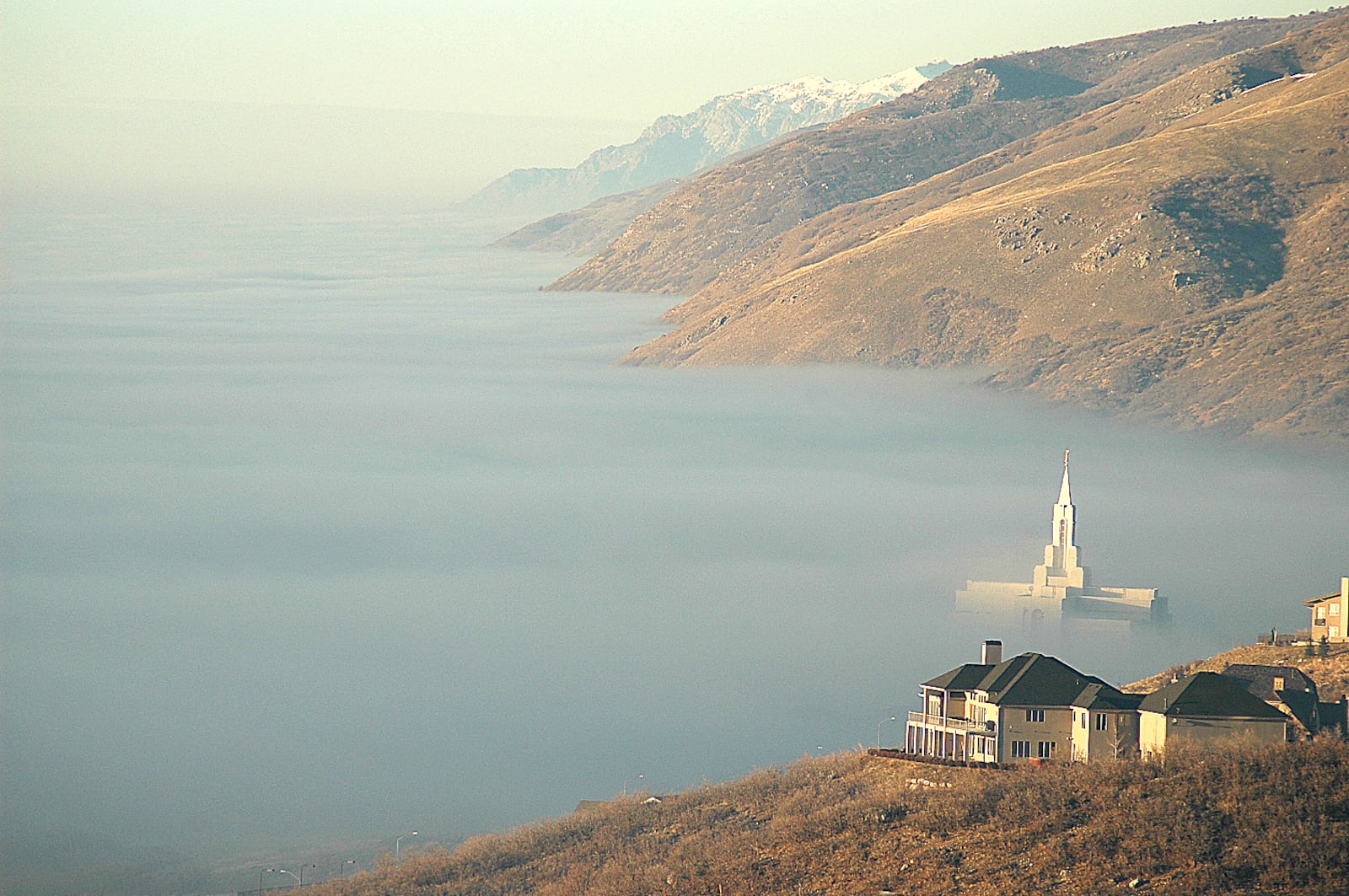 The Bountiful Utah Temple pokes through the fog as it envelops the valleys along the Wasatch Front in 2004.