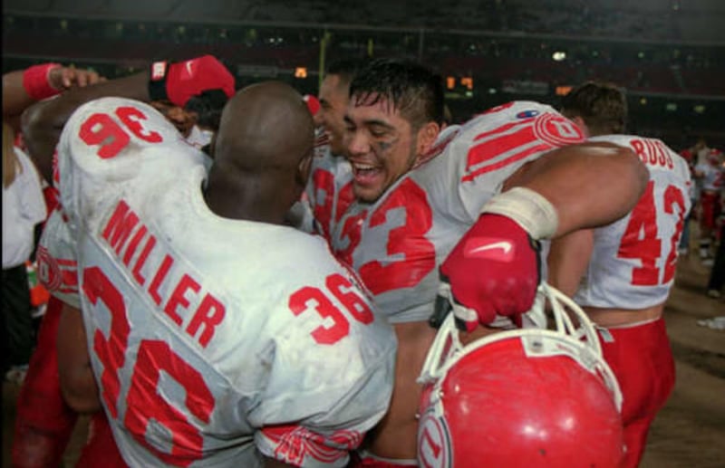 Luther Elliss celebrates at end of freedom bowl win. 10/10/2002