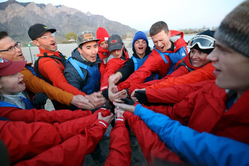 Ryan Greene, principal at the Utah Schools for the Deaf and the Blind, leads a cheer at Pelican Beach.