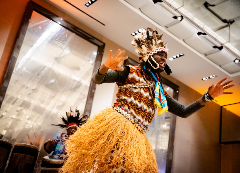 A participant performs a traditional dance from the Democratic Republic of the Congo during the first-ever Light the World dinner hosted by The Church of Jesus Christ of Latter-day Saints in Geneva, Switzerland, on Tuesday, Dec. 2, 2025.