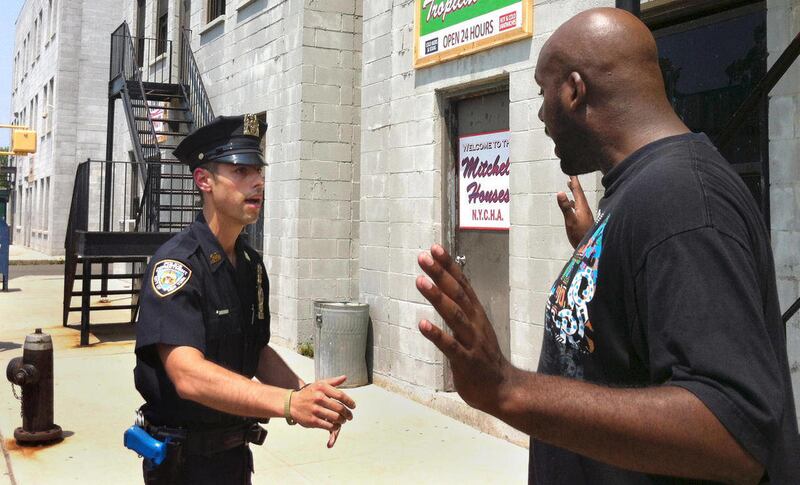 Det. Anthony Mannuzza, left, and Police Officer Robert Martin, right, simulate a street stop during a training session on Wednesday, June 20, 2012 at the New York Police Department's (NYPD) training facility in Rodman's Neck, in the Queens borough of New