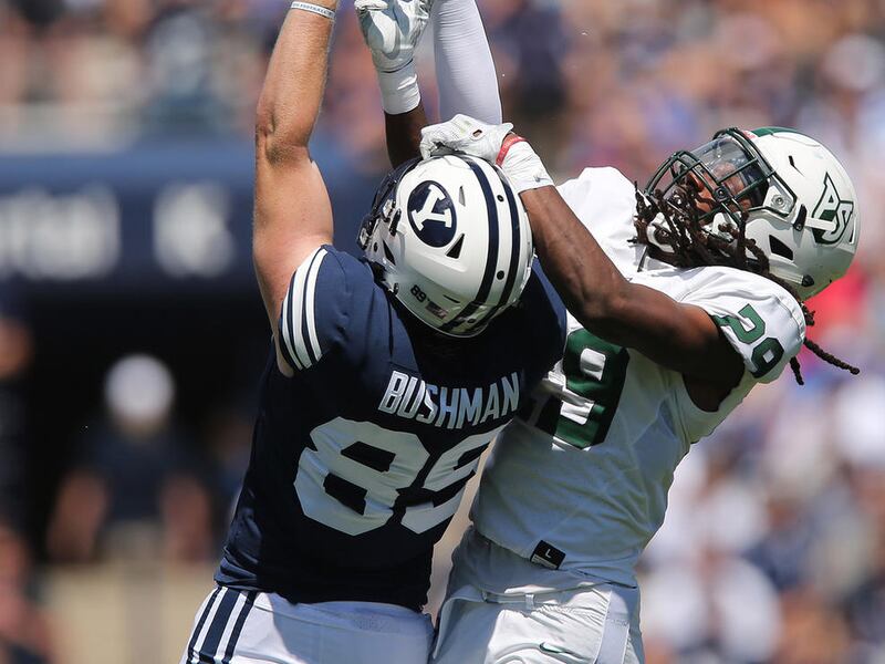 Brigham Young Cougars tight end Matt Bushman (89) makes a catch over Portland State Vikings cornerback Donovan Olumba (29) in Provo on Saturday, Aug. 26, 2017. BYU won 20-6.