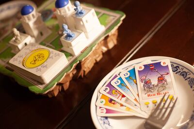 Pieces from the two-player board games Santorini; Bohnanza: The Duel; and Fog of Love.