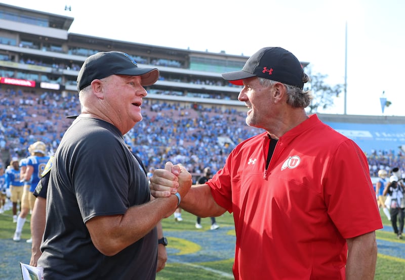 UCLA coach Chip Kelly and Utah coach Kyle Whittingham shake hands after Utah’s loss at the Rose Bowl on Oct. 8, 2022.