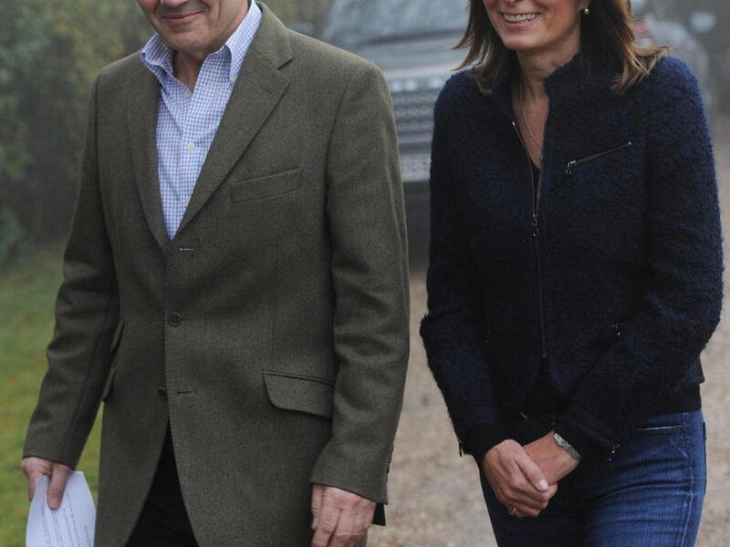 In this Nov. 16, 2010 file photo, Michael and Carole Middleton, the parents of Kate Middleton, prepare to make a statement on the engagement of their daughter to Britain's Prince William, outside their home near the village of Bucklebury, England. The Mid
