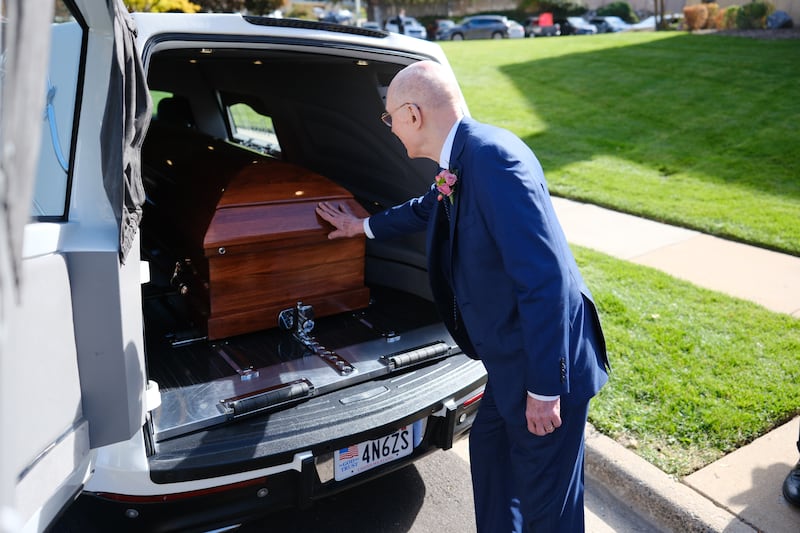 President Henry B. Eyring touches the casket of his wife, Sister Kathleen Johnson Eyring after her funeral on Oct. 21, 2023.